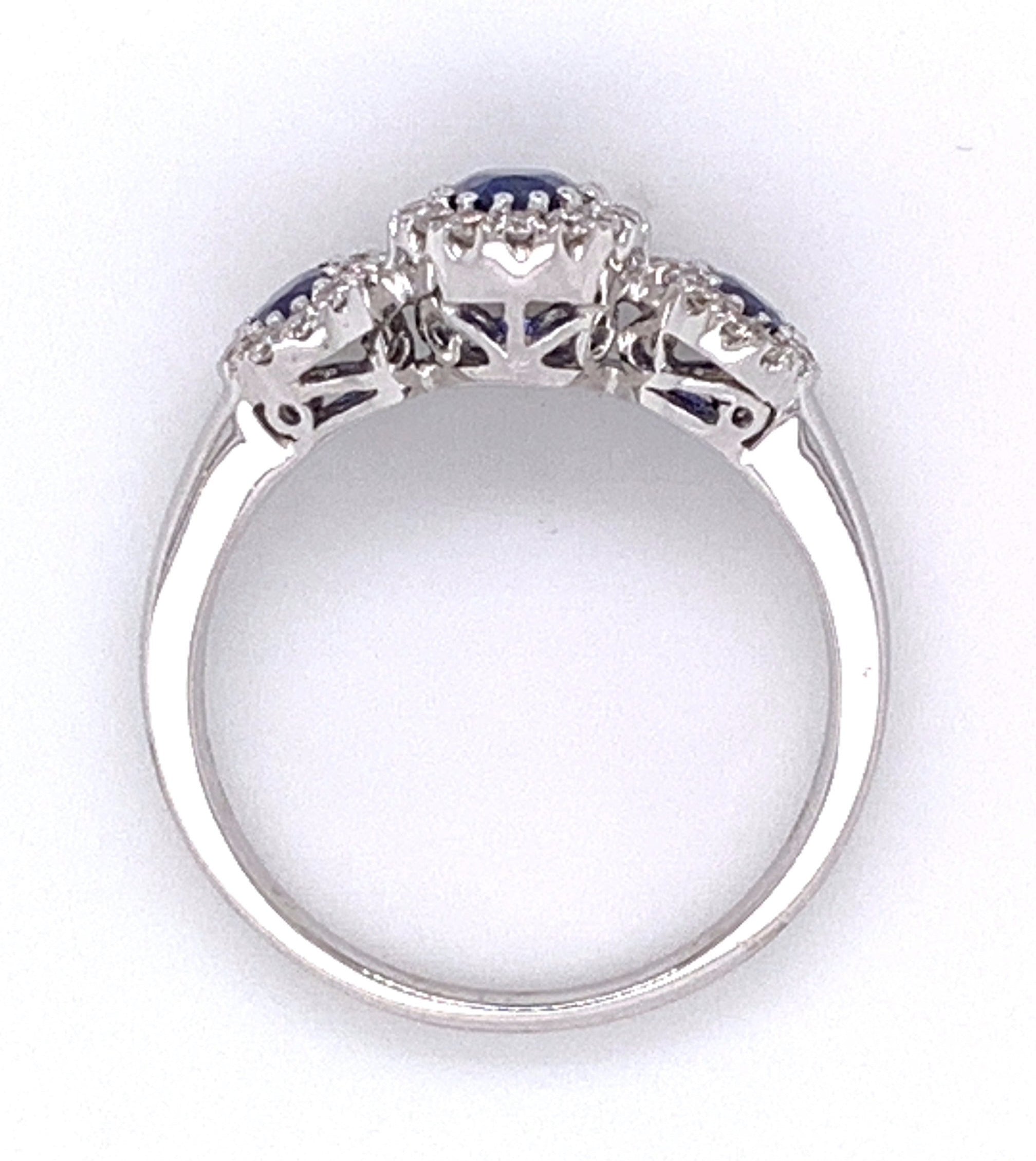 Blue Sapphire Three Stone and Diamond Halo Ring