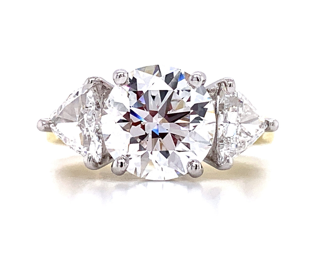3.70ct Round Brilliant Cut Center with 1.60ct t.w. 2 Trillion Cut Side Diamond Engagement Ring