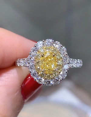 Canary Fancy Vivid Yellow Oval Cut 1.74ct t.w. Halo Ring